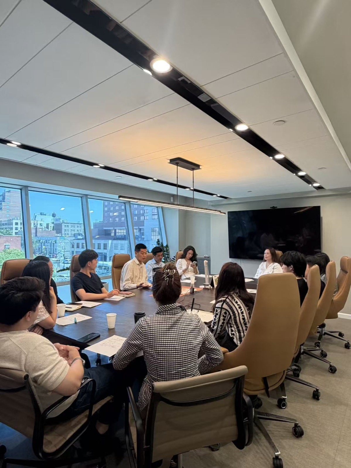 Homix agents gathered around a conference table for training
