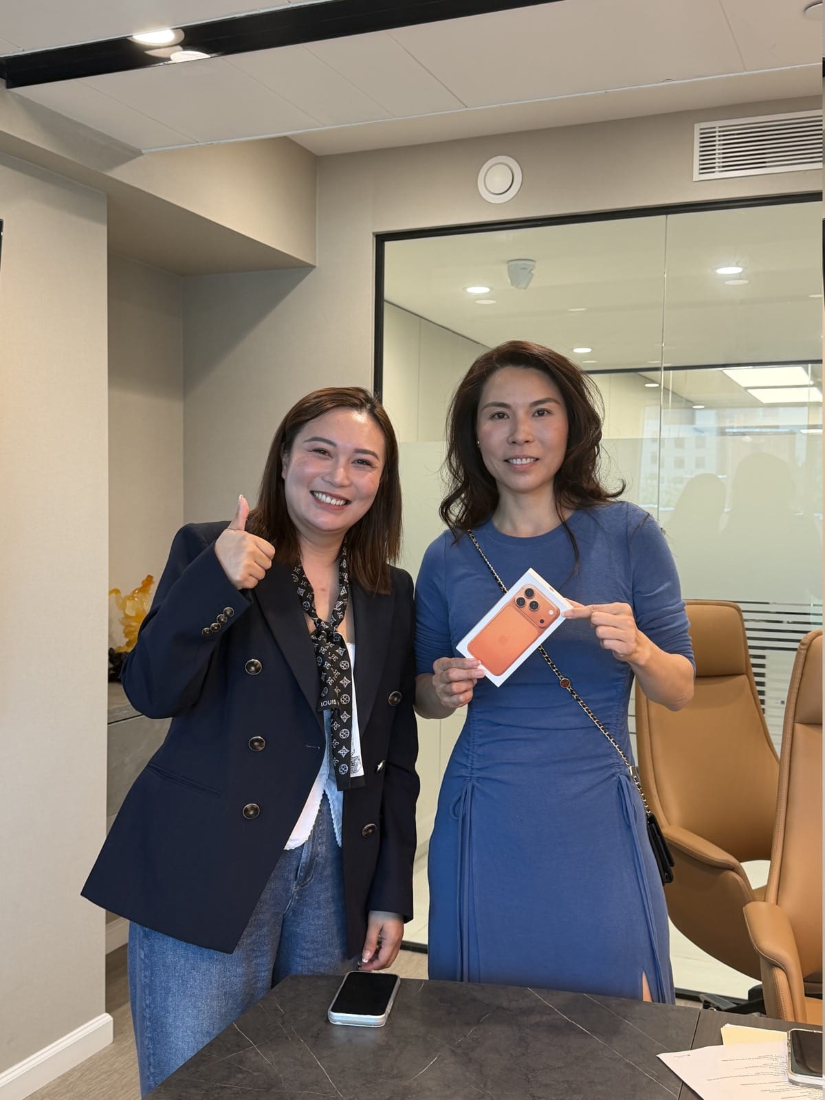 Homix advisors celebrating a training milestone in the office